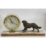 An Art Deco marble mantel clock surmounted with a bronzed spelter dog, width 50cm