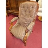 A mid-Victorian mahogany framed and buttoned floral fabric upholstered scroll open armchair, w.69cm