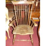 An early 20th century elm seat and beech stickback farmhouse open armchair, w.62cm
