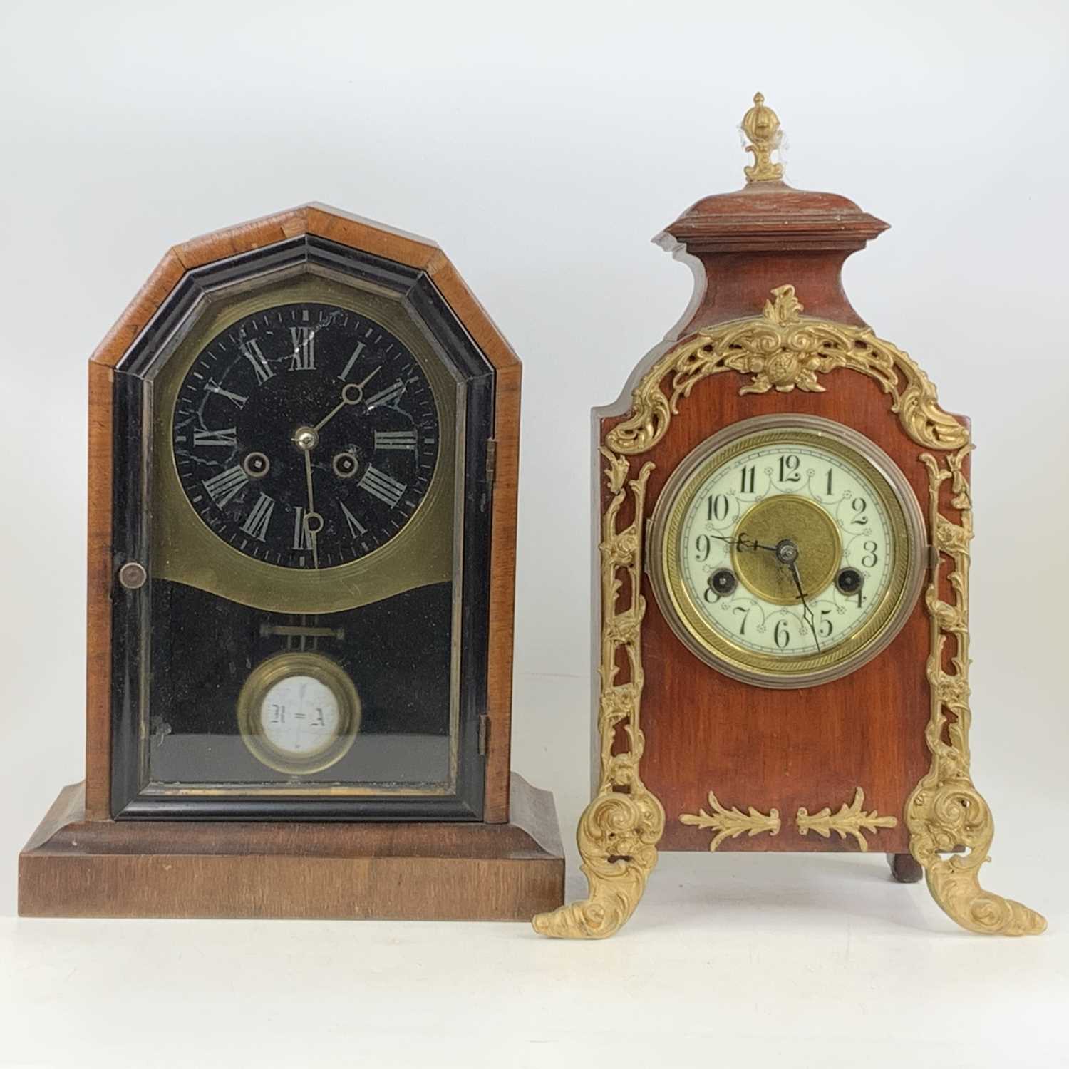 A circa 1900 American walnut cased mantel clock, h.33cm; together with an early 20th century