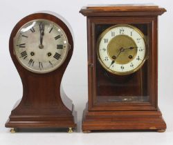 An Edwardian mahogany and ebony strung balloon shaped mantel clock, having brass cylinder movement