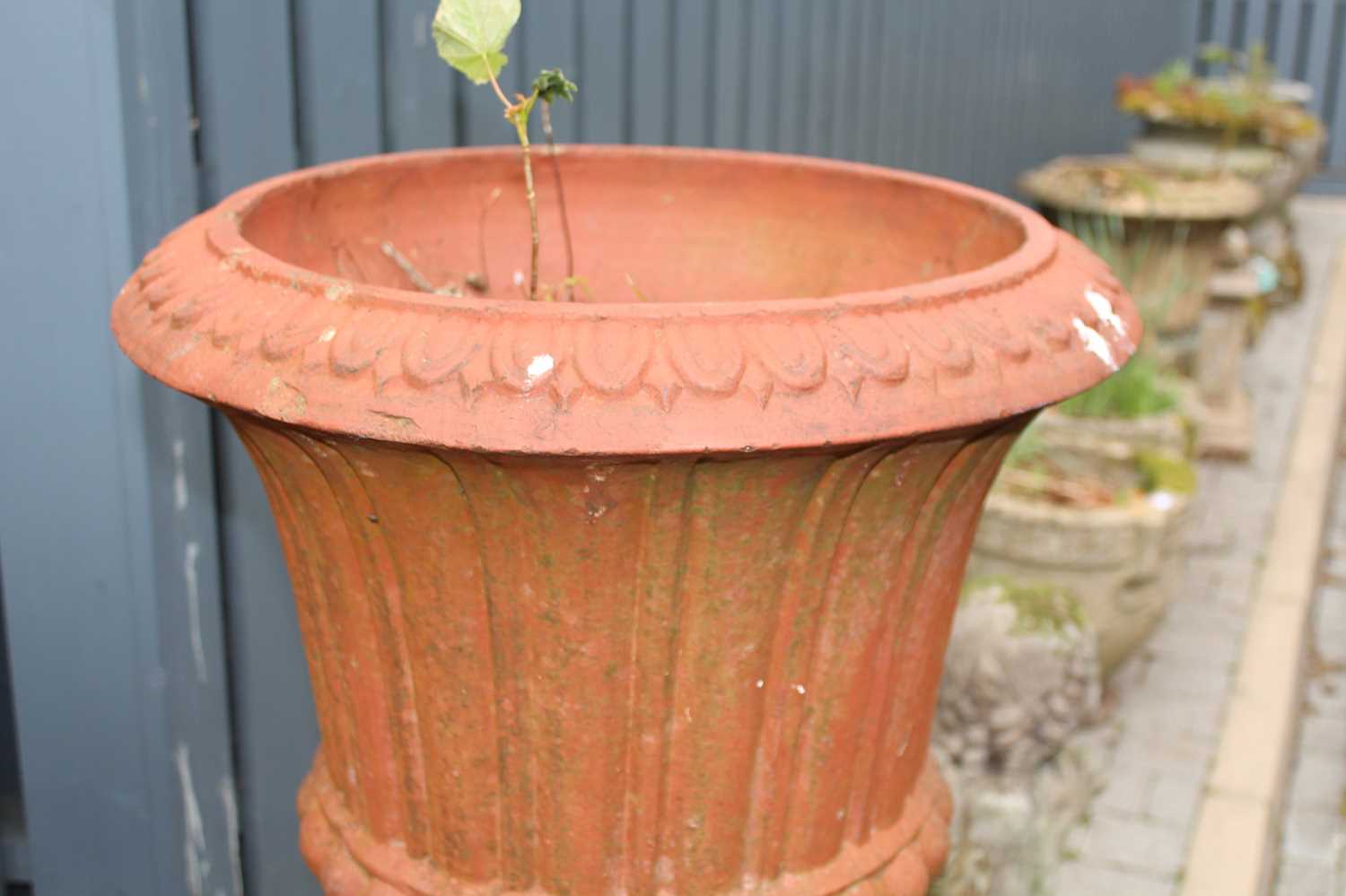 A terracotta fluted pedestal garden urn, raised on a square stepped base, overall height 123.5cm - Image 3 of 4