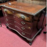 A Dutch mahogany bombe shaped chest, of four long graduated drawers on claw and ball feet, width