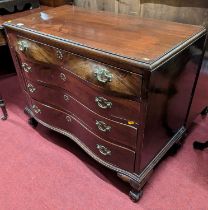 A Dutch mahogany bombe shaped chest, of four long graduated drawers on claw and ball feet, width
