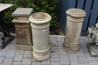 A pair of cream painted terracotta cylindrical chimney tops, each height 76cm, together with a