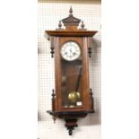 A late 19th century Vienna walnut cased and ebonised droptrunk wall clock, h.90cm