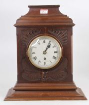 An early 20th century American walnut cased mantel clock, height 41cm, together with an Edwardian