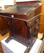 A late Victorian mahogany slopefront davenport, having a leather gilt-tooled inset surface, hinged