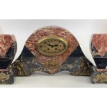 An Art Deco rouge marble three-piece clock garniture, clock height 26cm