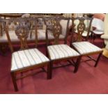 A set of three Chippendale style mahogany splatback dining chairs, each having striped upholstered