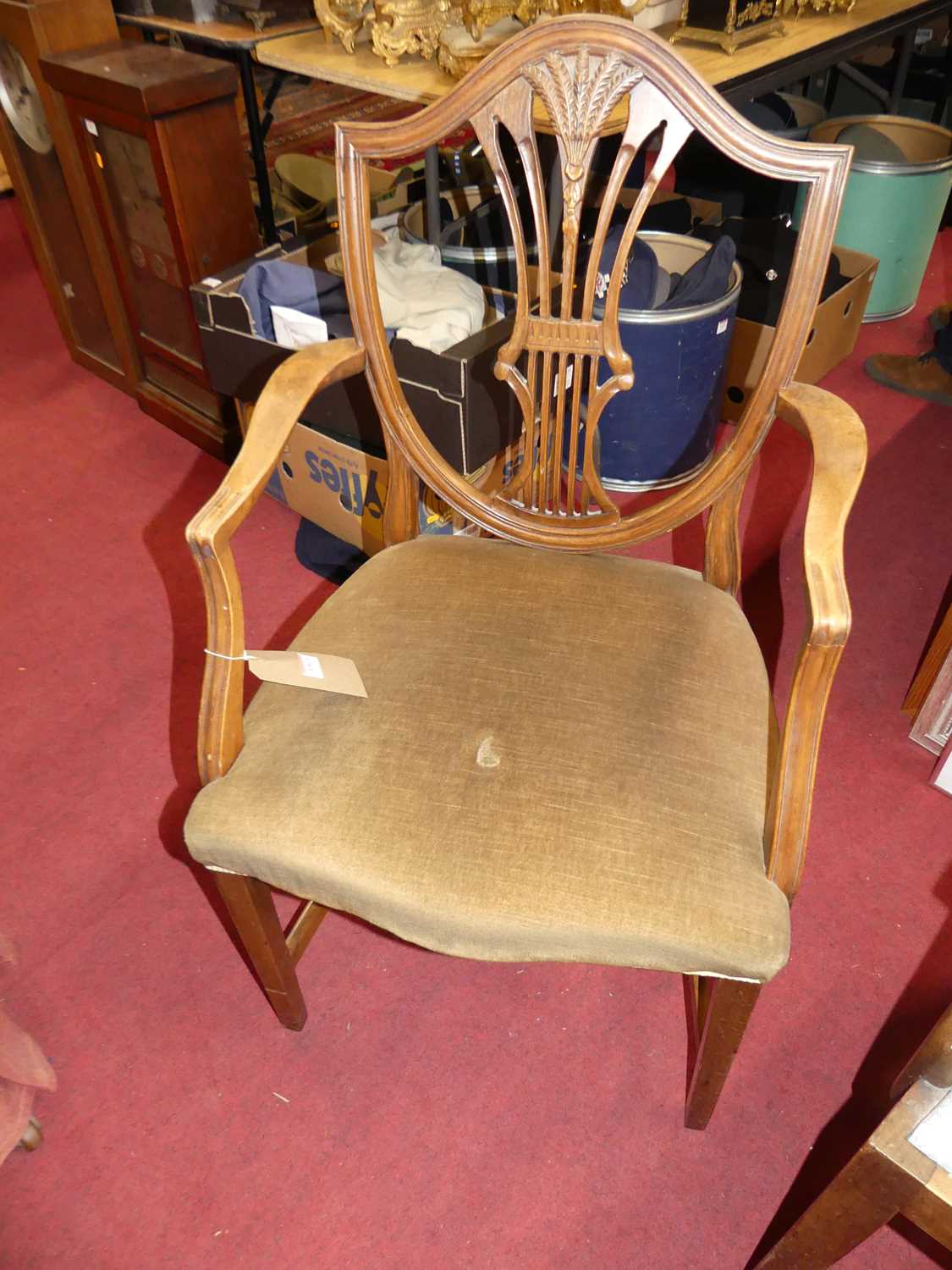 A 19th century mahogany Heppelwhite elbow chair; together with another mahogany Heppelwhite elbow - Image 2 of 3