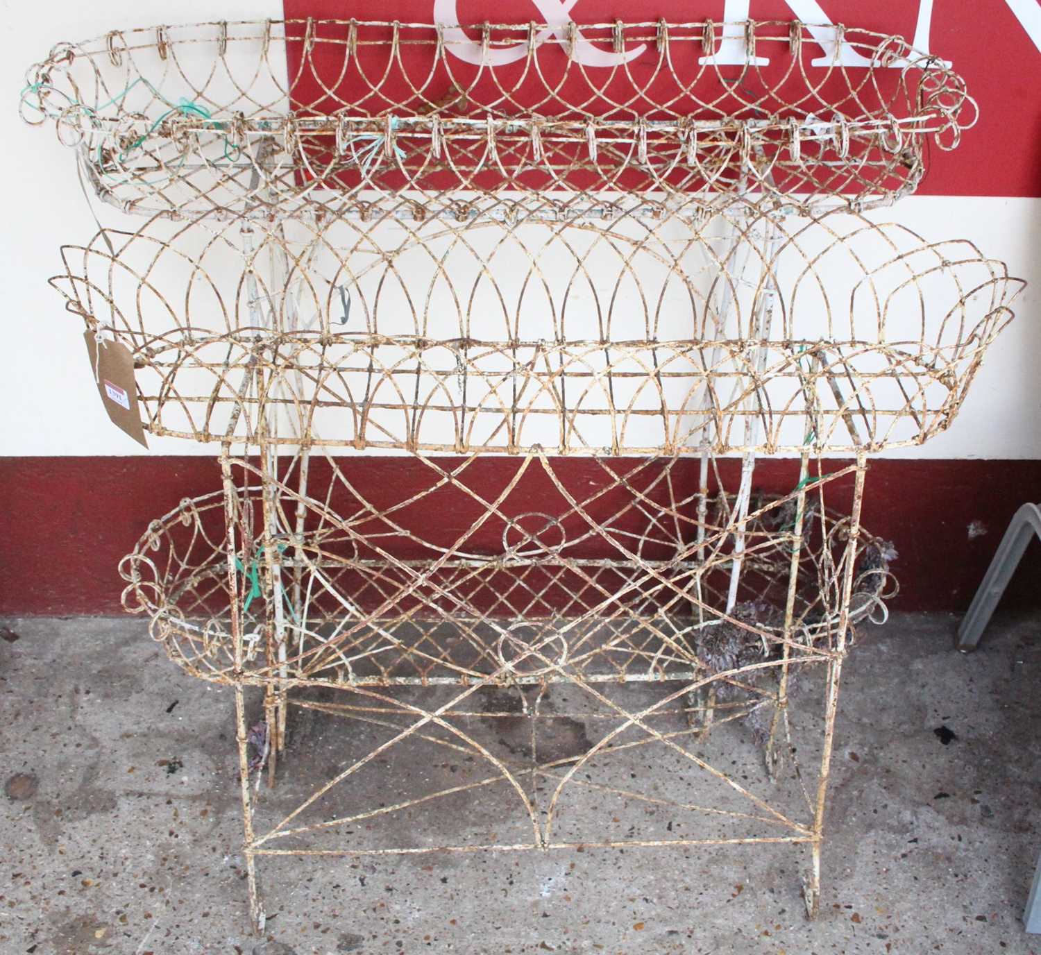 Two 19th century painted wried metal plant stands, each approx width 100cm Generally rusty and