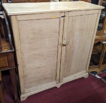 A rustic pine low double door side cupboard, fitted with interior shelves, width 107.5cm