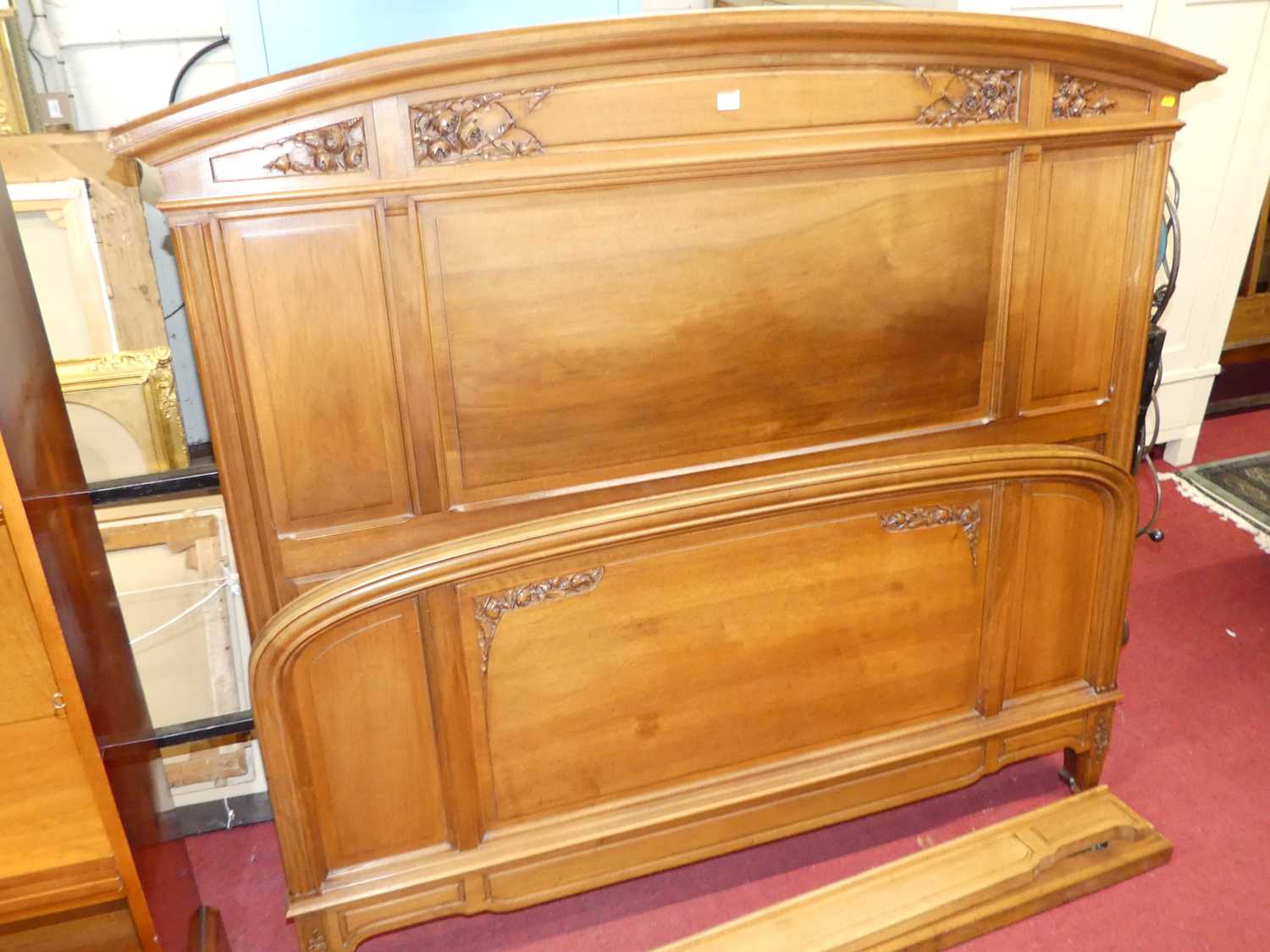 A circa 1900 Vienna secessionist walnut double bedstead, the recessed panelled head and footboard