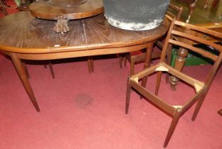 A 1960s G-Plan Fresco teak D-end extending table, having pull-out action and single fold-out leaf,
