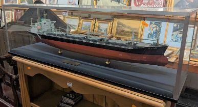A scale model of the "MV Don Salvador III" housed in a perspex case, with engraved brass plaque,