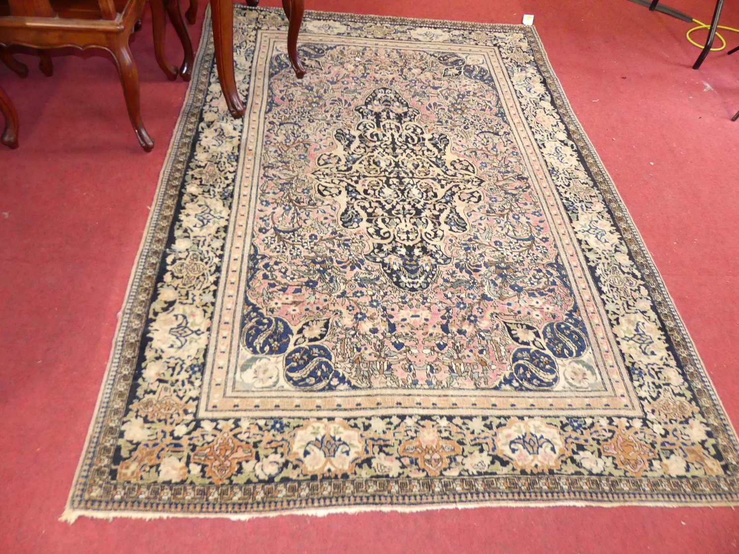 A Persian woollen red & cream ground Nain rug, 205 x 141cm