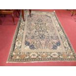 A Persian woollen red & cream ground Nain rug, 205 x 141cm