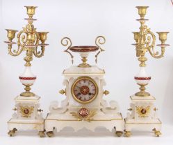 A late 19th century alabaster and gilt metal three-piece clock garniture, the garniture each