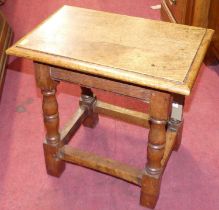 A joined oak and elm joint stool, raised on turned and square cut supports, length 44cm