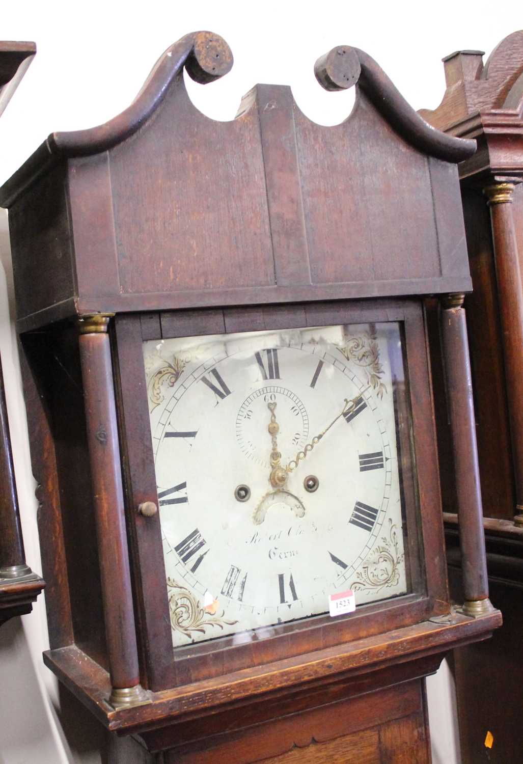 An early 19th century oak and mahogany crossbanded long case clock, having an indistinctly signed