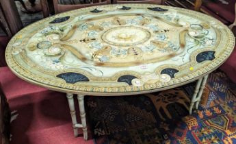 A painted classical style large oval coffee table, raised on bamboo effect supports, length 143cm