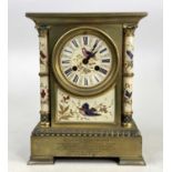 A late 19th century gilt bronze and soft paste porcelain mantel clock (lacking marble top) having