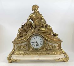 A French gilt brass and marble mantel clock, 20th century, the whole surmounted with a maiden and