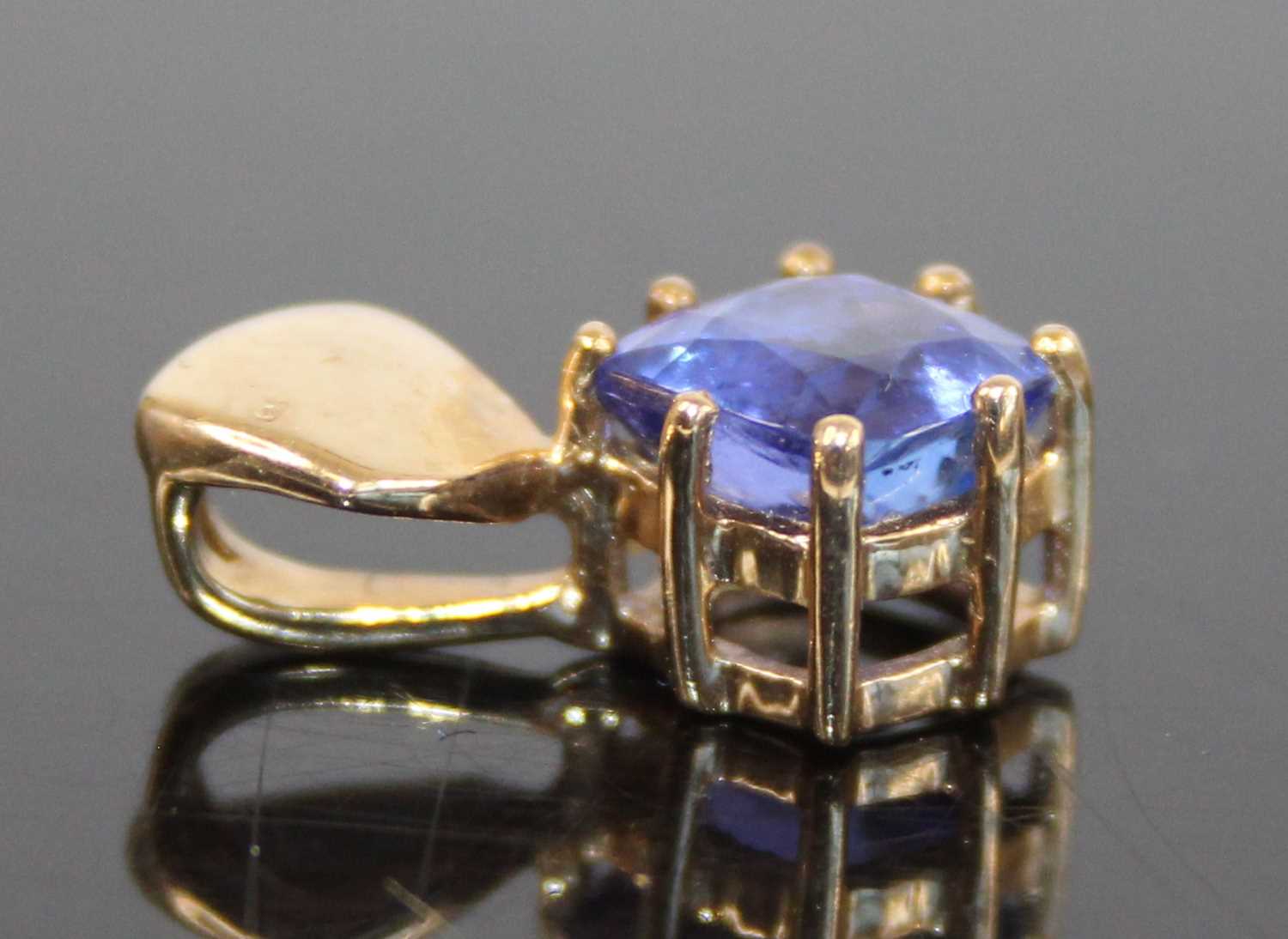 A 9ct gold tanzanite single stone pendant, featuring a cushion cut tanzanite in claw setting, - Image 9 of 9