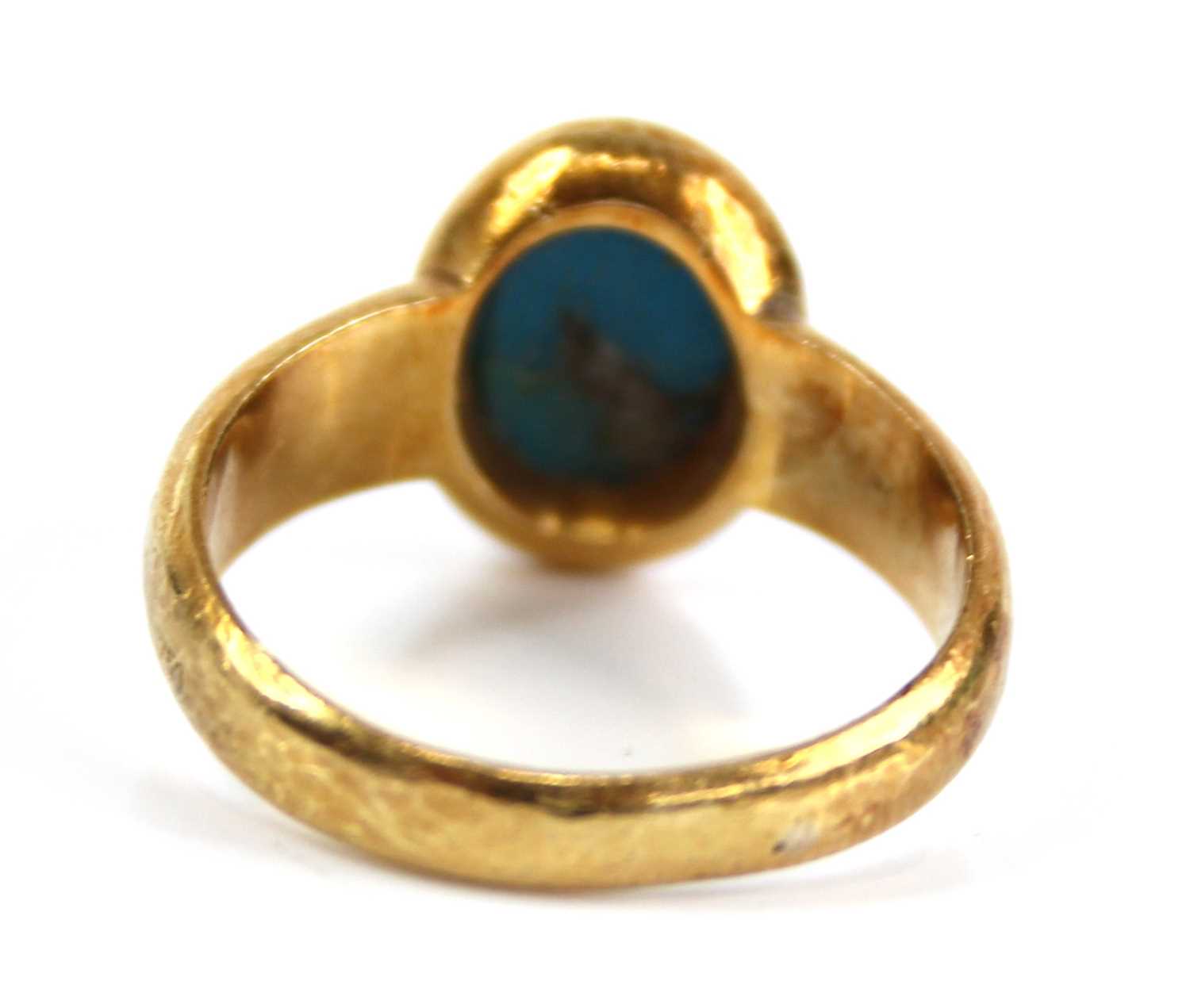 An Arts & Crafts yellow metal cabochon turquoise set dress ring, the turquoise measuring approx 7. - Image 4 of 7