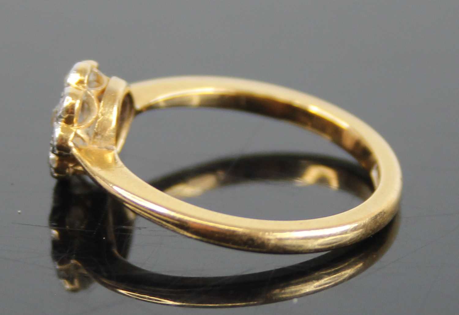 An 18ct gold diamond flower head cluster ring, arranged as a centre round cut within a surround of - Image 5 of 8