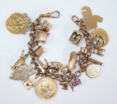 A 9ct gold curblink bracelet containing a collection of charms, principally in 9ct gold and to