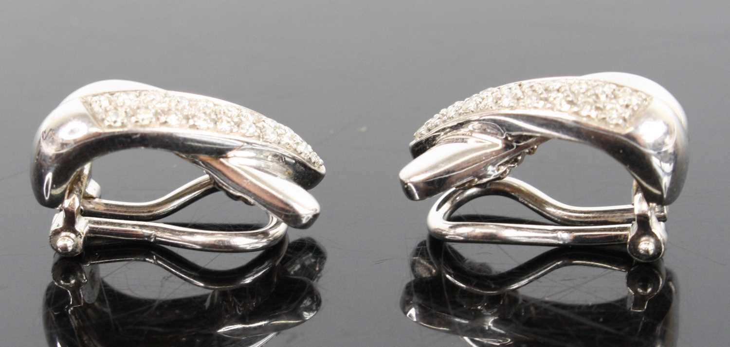 A pair of 18ct white gold diamond two-strand crossover clip earrings, each comprising a strand of 21 - Image 2 of 4