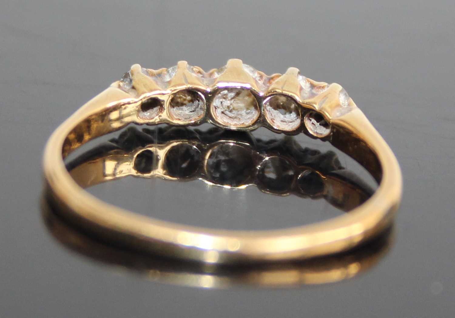 An 18ct gold and platinum diamond half hoop ring, arranged as five claw set graduated round cuts, - Image 4 of 7