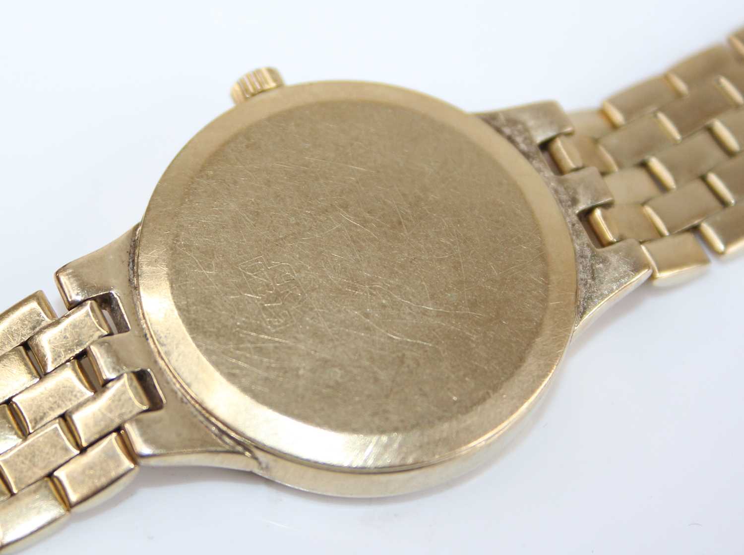 W. Croxton of England - a lady's 9ct gold cased quartz bracelet watch, having a signed gilded - Image 5 of 5