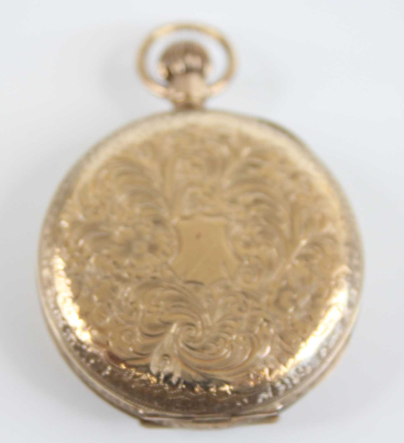 A lady's 9ct yellow gold open face keyless fob watch, having a round white dial with blue Arabic - Image 2 of 6
