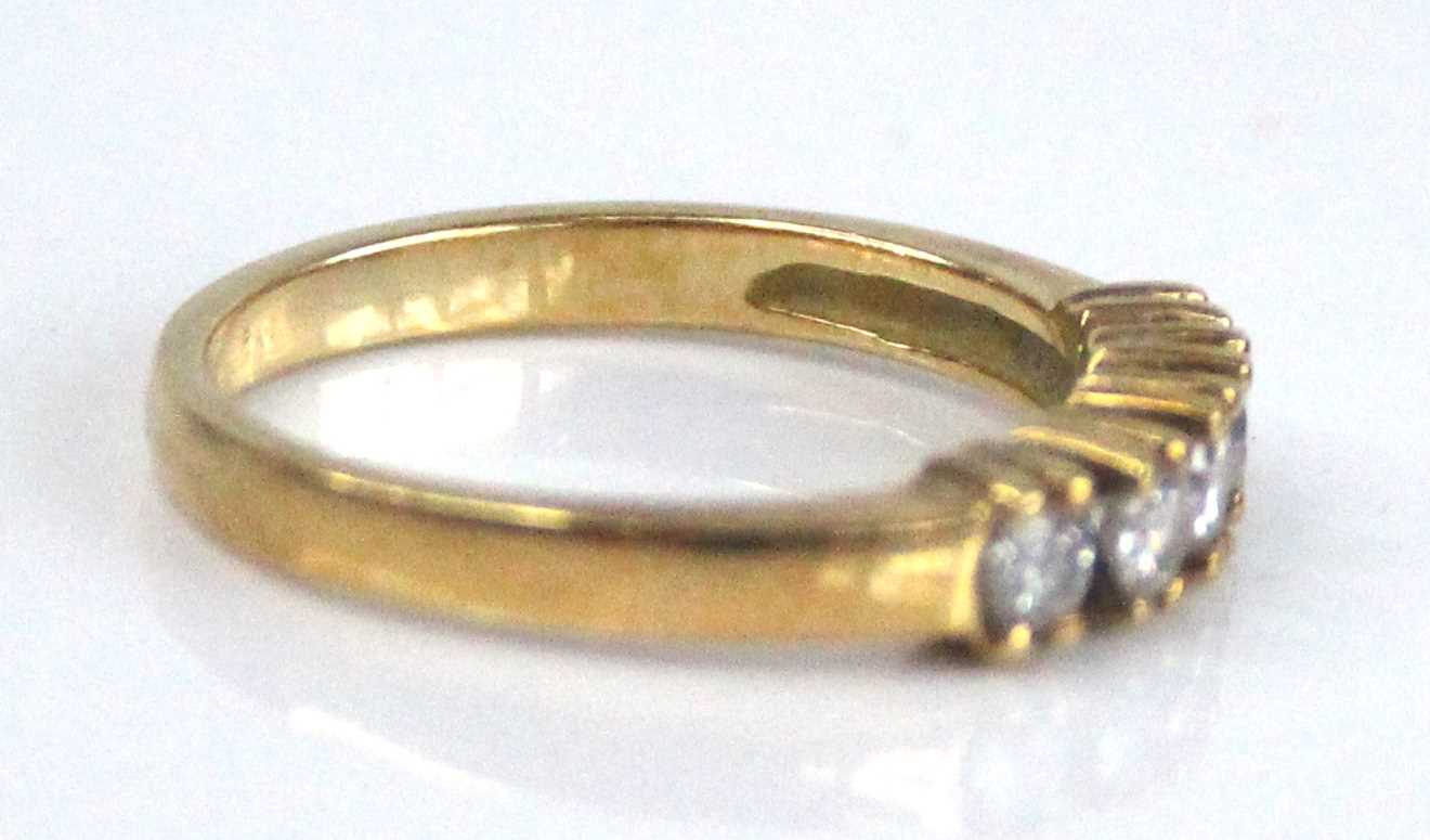 A yellow metal diamond half eternity ring, having five round brilliant cut diamonds in claw - Image 2 of 6