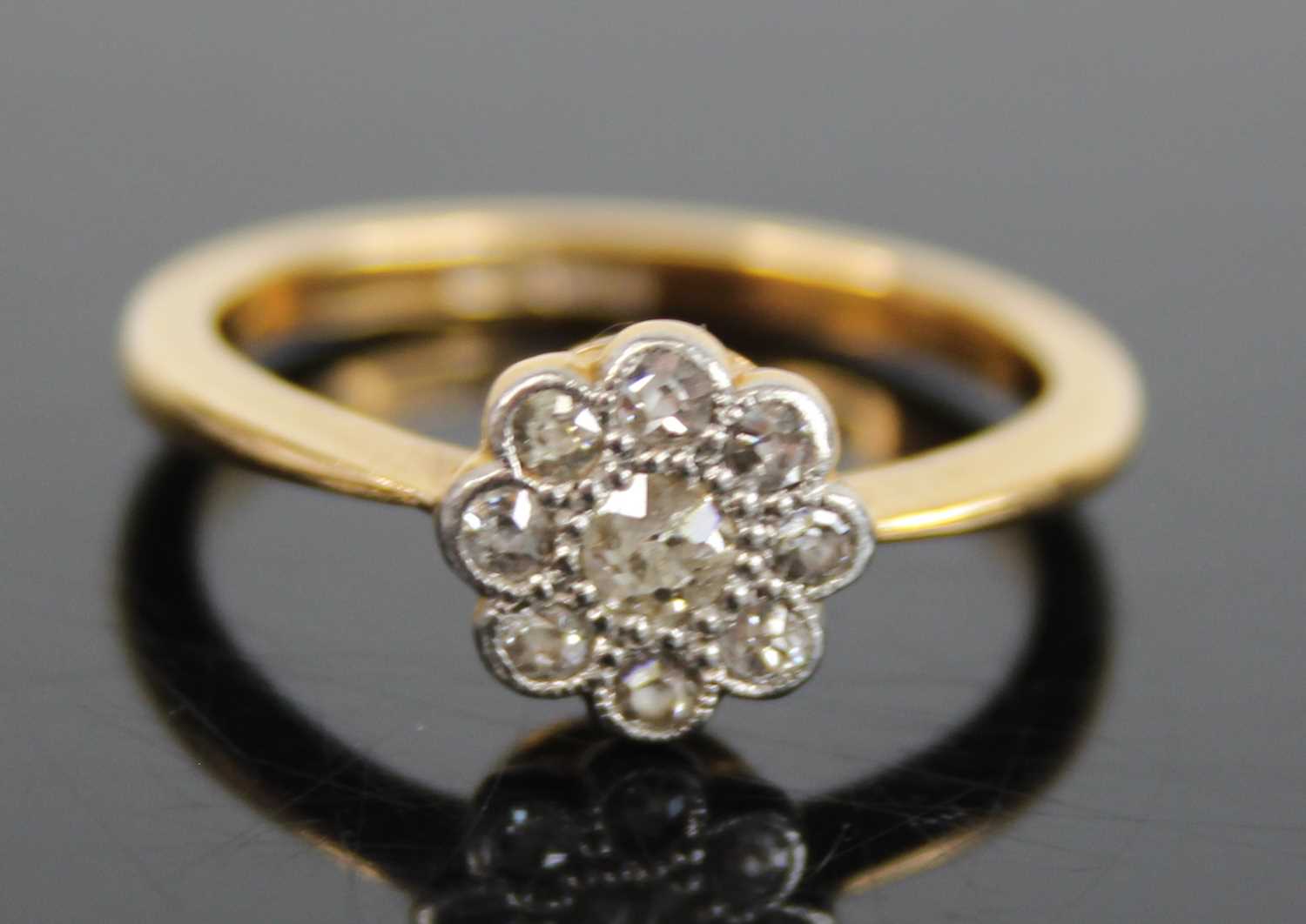 An 18ct gold diamond flower head cluster ring, arranged as a centre round cut within a surround of - Image 2 of 8