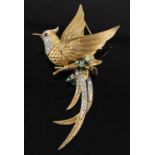 A Boucher gilt metal and paste set brooch, fashioned as an exotic bird with flowers, stamped