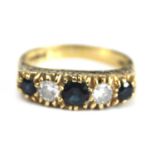 An 18ct yellow gold, sapphire and diamond half eternity ring, comprising three graduated round