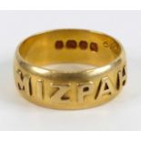A late Victorian 18ct yellow gold ring, with Mizpah in raised lettering around the outside from