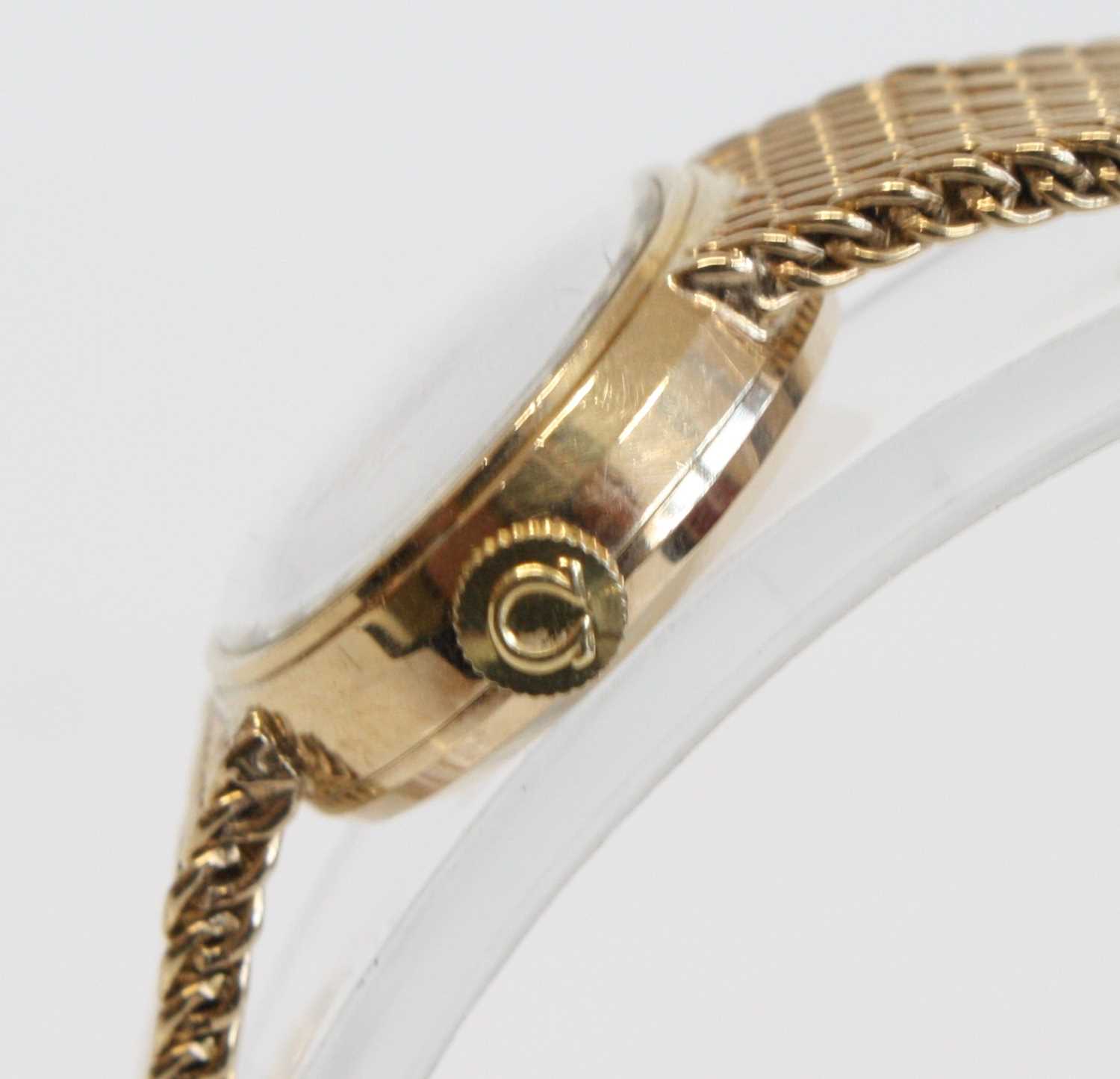 A lady's 9ct yellow gold Omega manual wind wristwatch with round silver baton dial and integral - Image 3 of 7