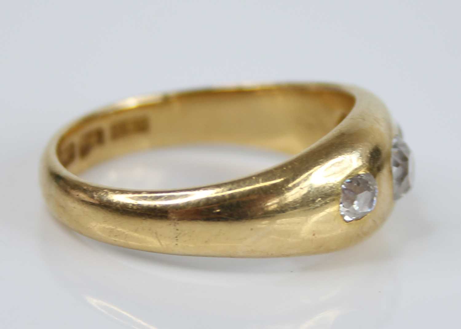 A gent's 18ct gold diamond three-stone ring, the flush set graduated old cushion cuts total weight - Image 2 of 5