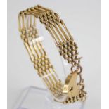 A 9ct gold gatelink bracelet, with heart shaped padlock clasp and safety chain, 19.4g, 18cm Evidence