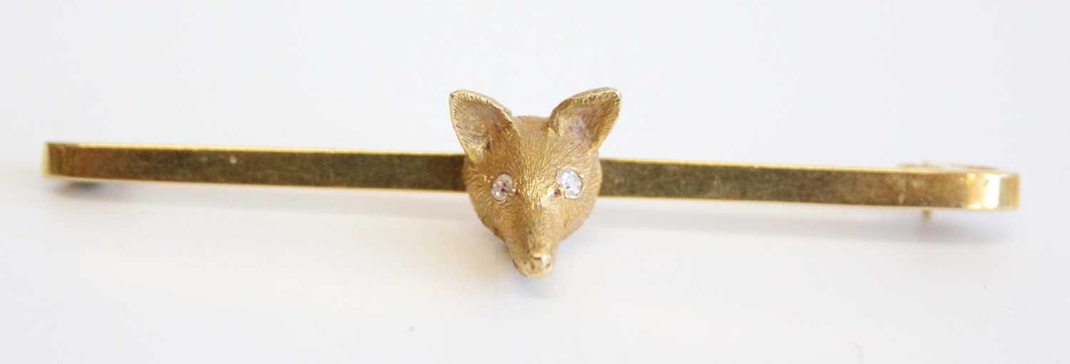 An 18ct gold safety pin bar brooch set with a fox's head, the eyes as two round cut diamonds, - Image 2 of 4