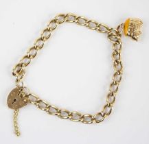 A 9ct gold curblink bracelet, with heart shaped padlock clasp and safety chain, containing one