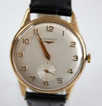 A gent's Longines 9ct gold cased wristwatch, having a signed silvered Arabic dial with subsidiary