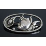 A 1940's Georg Jensen sterling silver floral brooch by Gundorph Albertus, comprising a stylised