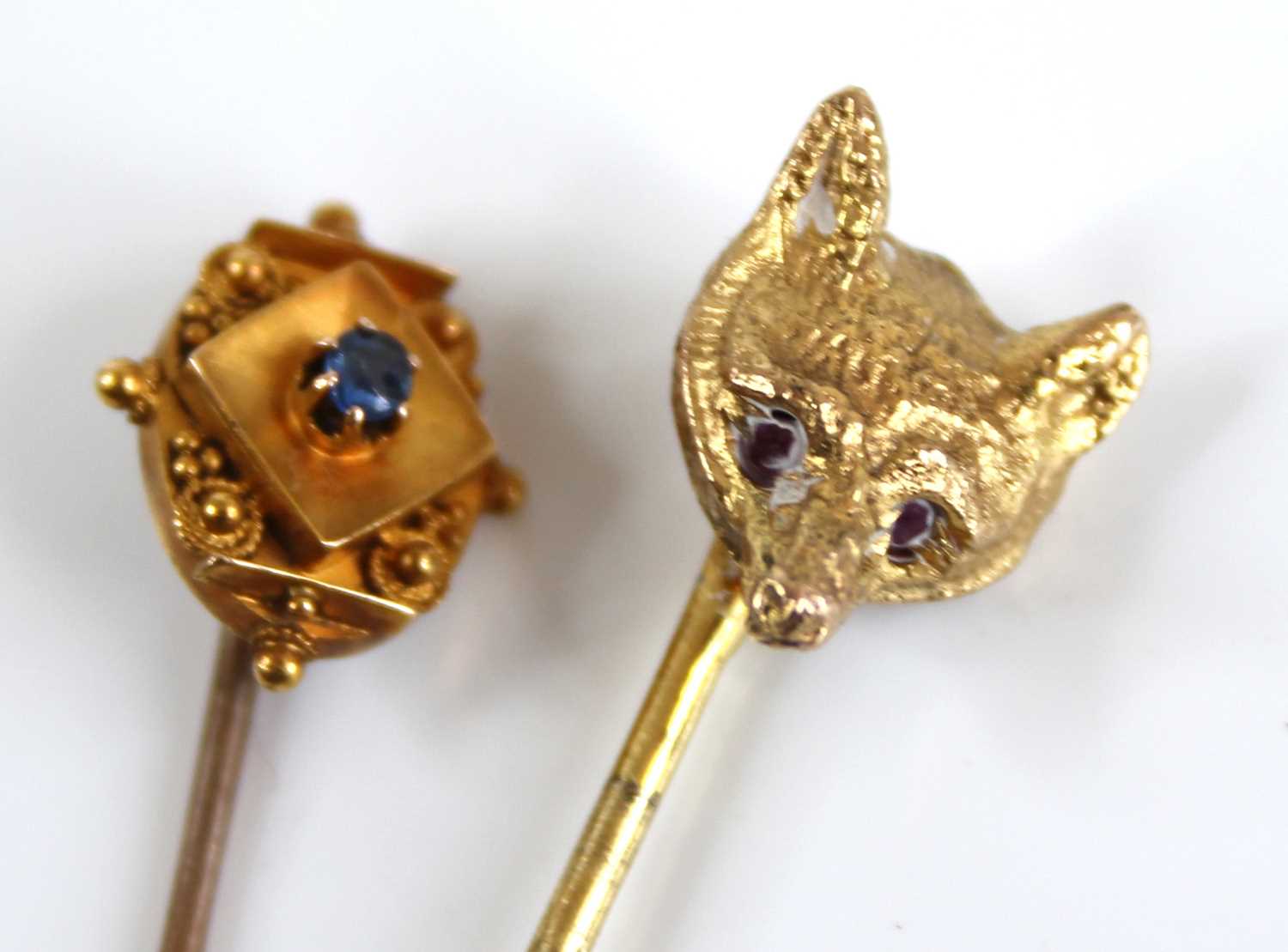 A 15ct gold round cut sapphire set tie-pin, 1.1g, 5.5cm; together with a 9ct gold fox head tie- - Image 2 of 3