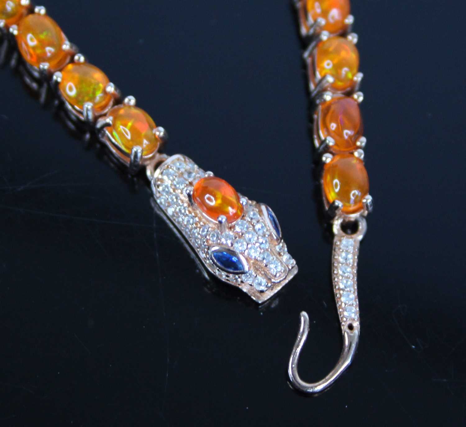 Two bracelets and a necklace, being a gilt metal snake bracelet with 28 oval orange paste stones - Image 3 of 4